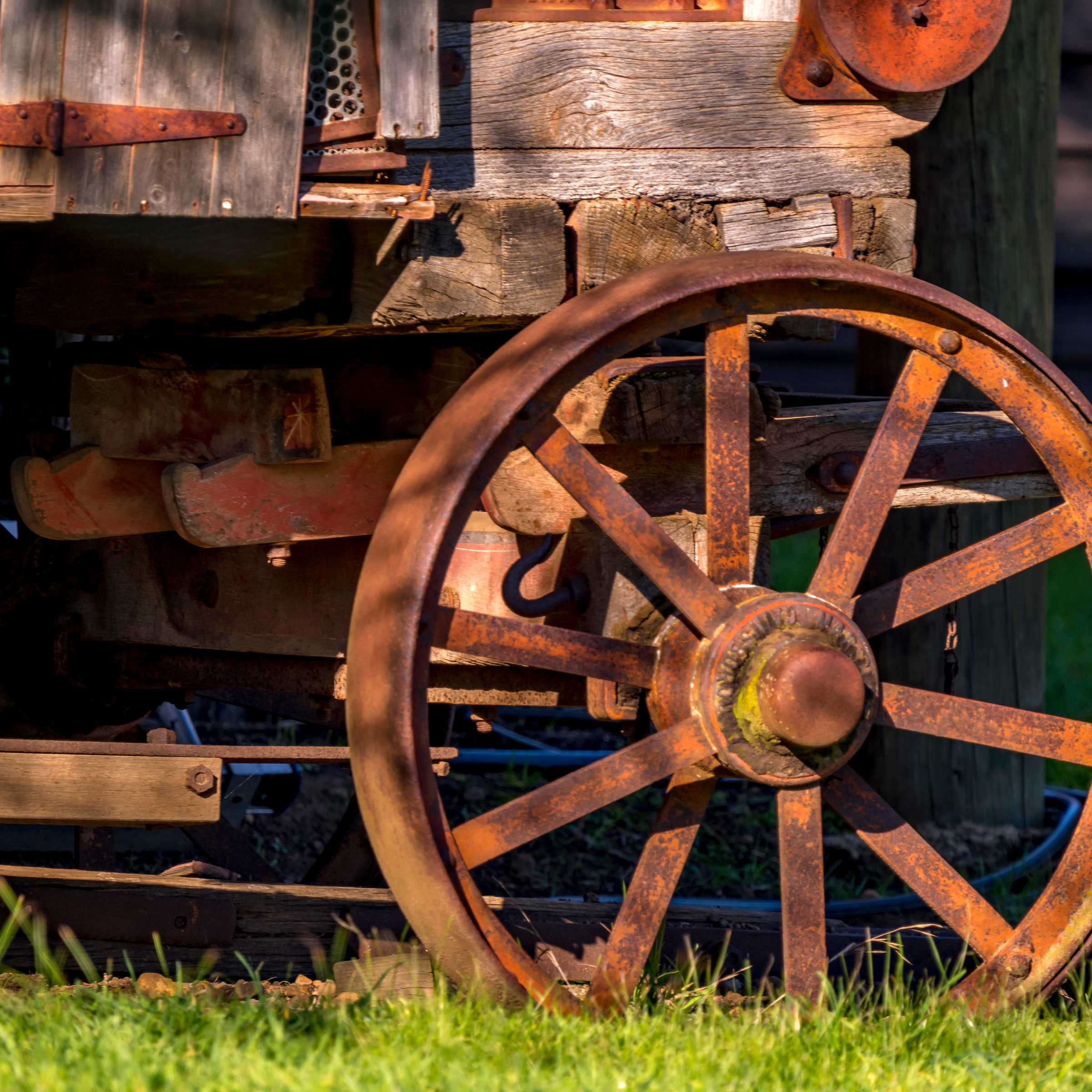 A steel spoked wheel and timber panelling are part of a Threshing machine that was used for harvesting grain. Circa 1900. Photo: Rob Burnett.